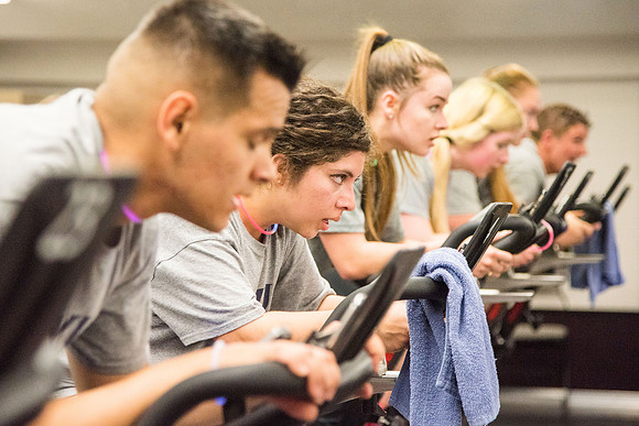 Students attend Cosmic Cycling Class at the Hart building.