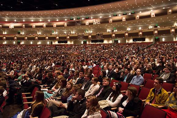 Students listen to Randal L. Ridd and take notes during the World Wide Devotional.