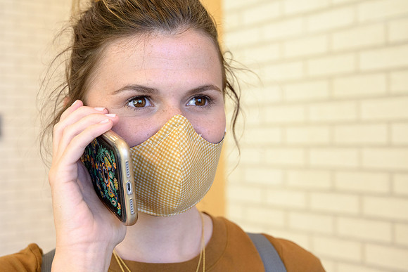 Student volunteers show the way to stay safe during this COVID 19 pandemic by social distancing, following pathway arrows and proper wearing of masks .
