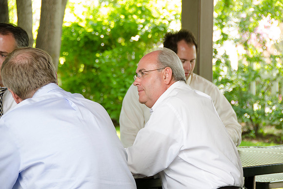 Employees of University Relations gather for a pleasant BBQ in the gardens.