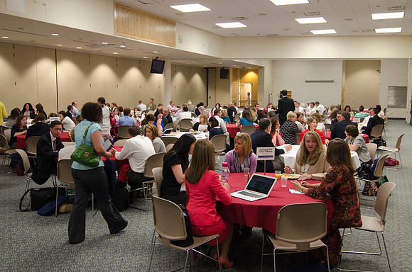 Online instructors gather for breakfast and instruction.