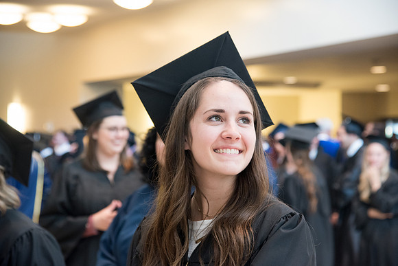 Graduates gather for procession before Commencement Services begin in the BYU-Idaho Center.
