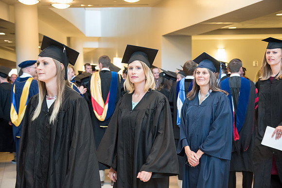 Graduates gather for procession before Commencement Services begin in the BYU-Idaho Center.