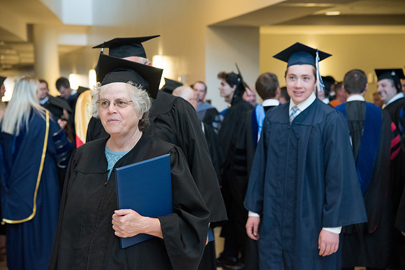 Graduates gather for procession before Commencement Services begin in the BYU-Idaho Center.