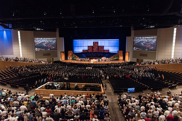 Graduates gather for Commencement Services in the BYU-Idaho Center.