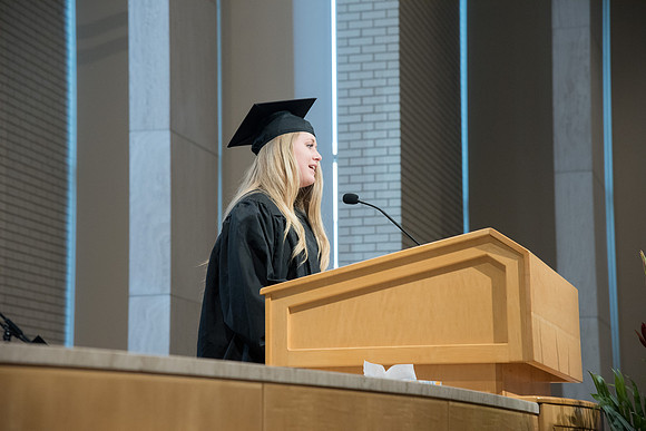 Madilyn Thomas, Child Development graduate give the Scripture at the Convocation of the Home and Family in the Taylor Chapel.