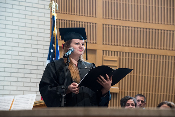 Family and Consumer Sciences graduate, Courtney Coon sings "Savior, Redeemer of My Soul" at the Home and Family Convocation in the Taylor Chapel.
