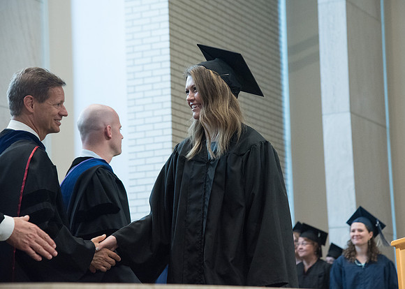 Awarding of Diplomas to graduates at the Home and Family Convocation in the Taylor Chapel.