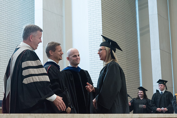 Awarding of Diplomas to graduates at the Home and Family Convocation in the Taylor Chapel.