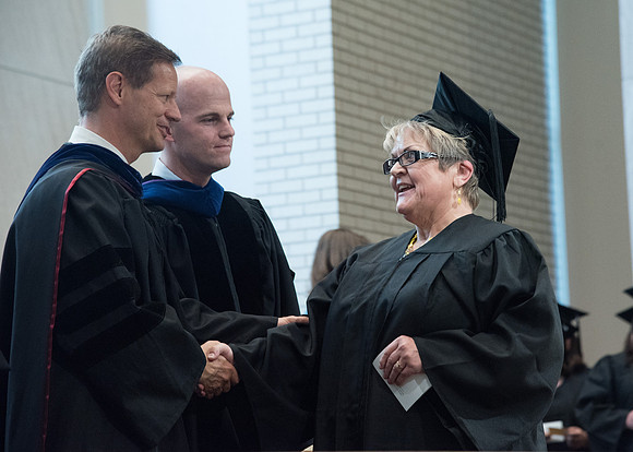 Awarding of Diplomas to graduates at the Home and Family Convocation in the Taylor Chapel.