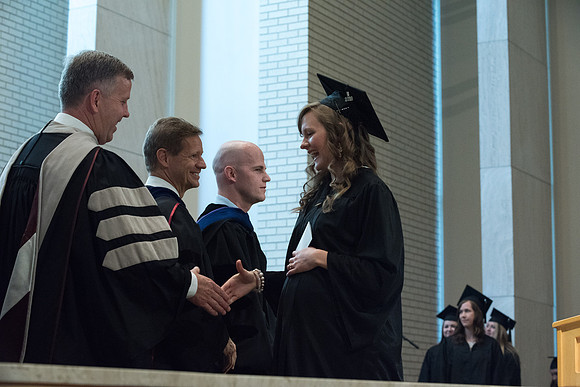 Awarding of Diplomas to graduates at the Home and Family Convocation in the Taylor Chapel.