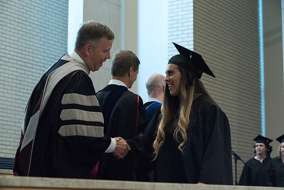 Awarding of Diplomas to graduates at the Home and Family Convocation in the Taylor Chapel.