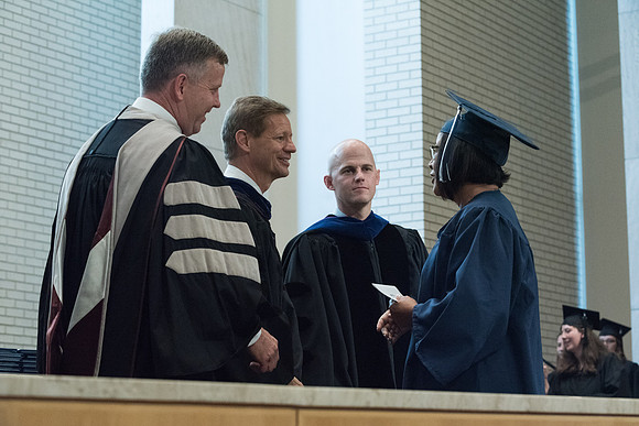 Awarding of Diplomas to graduates at the Home and Family Convocation in the Taylor Chapel.
