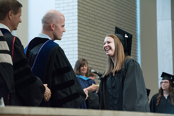 Awarding of Diplomas to graduates at the Home and Family Convocation in the Taylor Chapel.