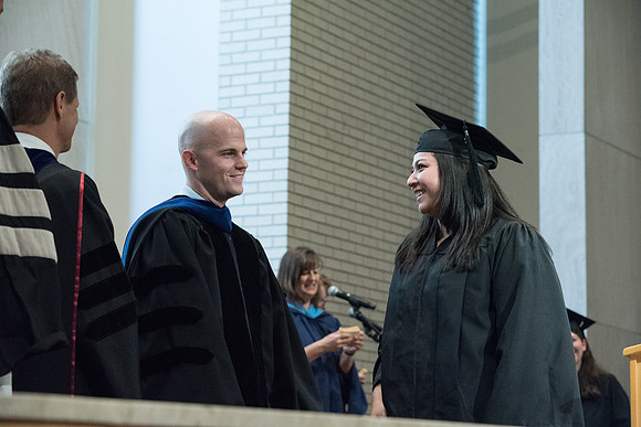 Awarding of Diplomas to graduates at the Home and Family Convocation in the Taylor Chapel.