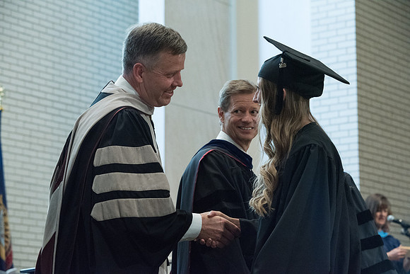 Awarding of Diplomas to graduates at the Home and Family Convocation in the Taylor Chapel.