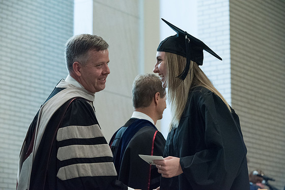 Awarding of Diplomas to graduates at the Home and Family Convocation in the Taylor Chapel.