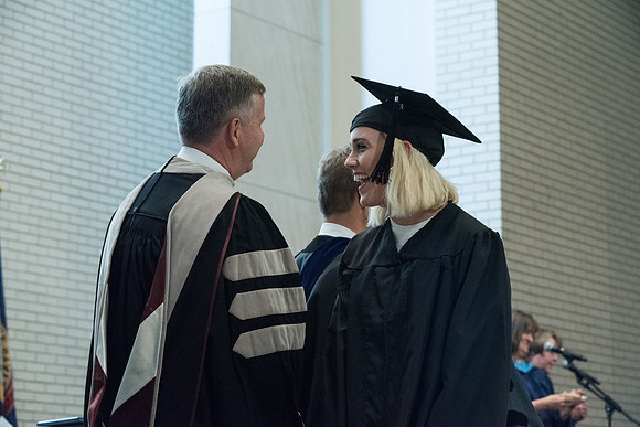 Awarding of Diplomas to graduates at the Home and Family Convocation in the Taylor Chapel.