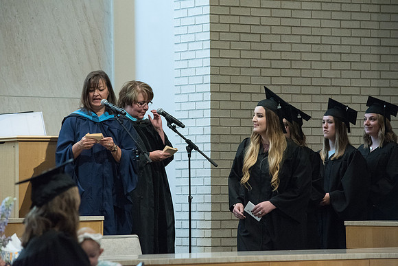Awarding of Diplomas to graduates at the Home and Family Convocation in the Taylor Chapel.