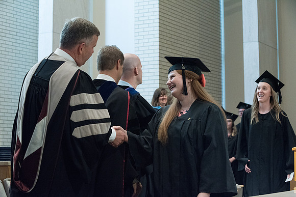Awarding of Diplomas to graduates at the Home and Family Convocation in the Taylor Chapel.