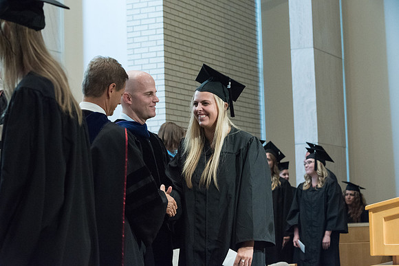 Awarding of Diplomas to graduates at the Home and Family Convocation in the Taylor Chapel.