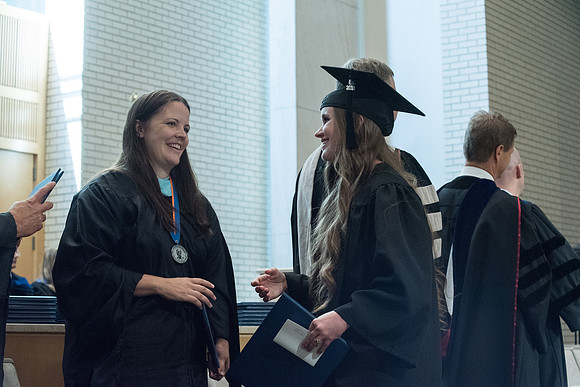 Awarding of Diplomas to graduates at the Home and Family Convocation in the Taylor Chapel.