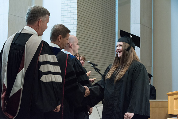 Awarding of Diplomas to graduates at the Home and Family Convocation in the Taylor Chapel.