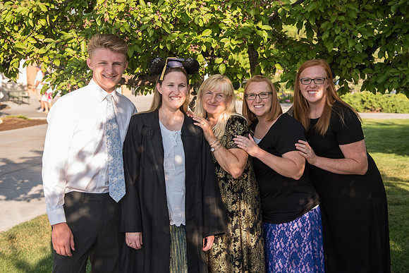 Graduate with their Family outside the Taylor Building.