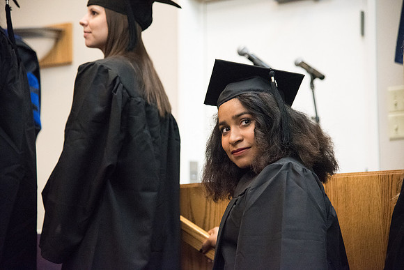 Graduates shake Elder Kim B. Clark's hand before being awarded their Diploma at Convocation of the Sociology and Social Work/Psychology in the Hinckley Chapel. July 2018