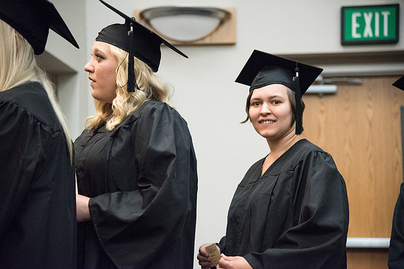 Graduates shake Elder Kim B. Clark's hand before being awarded their Diploma at Convocation of the Sociology and Social Work/Psychology in the Hinckley Chapel. July 2018