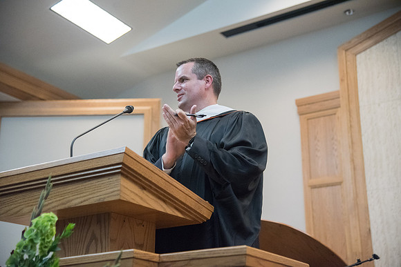 Nathan J, Meeker, Chair, Department of Sociology and Social Work applauds the graduates at Sociology and Social Work/Psychology Convocation in the Hinckley Chapel. July 2018