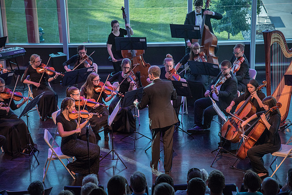 BYU-Idaho Orchestra made up of 24 talented musicians tours the Great Lakes region under direction of Dr. Dallin Hansen. Concert in Cedar Rapids, Iowa in the Whipple Auditorium, Public Library.