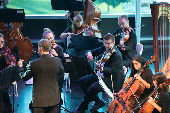 BYU-Idaho Orchestra made up of 24 talented musicians tours the Great Lakes region under direction of Dr. Dallin Hansen. Concert in Cedar Rapids, Iowa in the Whipple Auditorium, Public Library.