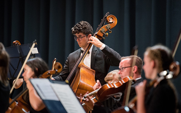 BYU-Idaho Orchestra made up of 24 talented musicians tours the Great Lakes region under direction of Dr. Dallin Hansen. Concert in Des Moines, Iowa at the Central Campus High School Auditorium.