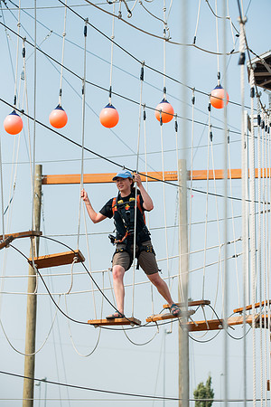 BYUI Students climbing around the ropes course by the upper fields in the summer of 2021.