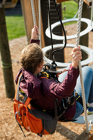 BYUI Students climbing around the ropes course by the upper fields in the summer of 2021.
