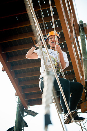 BYUI Students climbing around the ropes course by the upper fields in the summer of 2021.