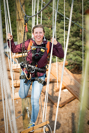 BYUI Students climbing around the ropes course by the upper fields in the summer of 2021.