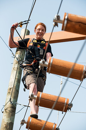 BYUI Students climbing around the ropes course by the upper fields in the summer of 2021.