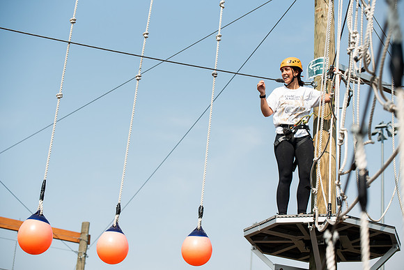 BYUI Students climbing around the ropes course by the upper fields in the summer of 2021.