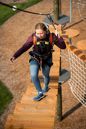 BYUI Students climbing around the ropes course by the upper fields in the summer of 2021.