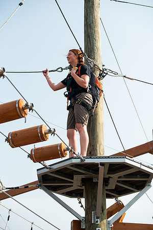 BYUI Students climbing around the ropes course by the upper fields in the summer of 2021.