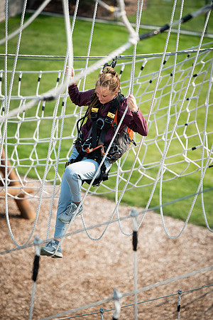 BYUI Students climbing around the ropes course by the upper fields in the summer of 2021.
