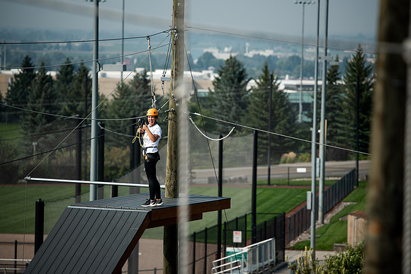 BYUI Students climbing around the ropes course by the upper fields in the summer of 2021.