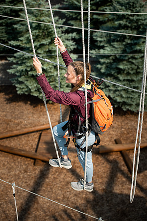 BYUI Students climbing around the ropes course by the upper fields in the summer of 2021.