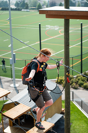 BYUI Students climbing around the ropes course by the upper fields in the summer of 2021.