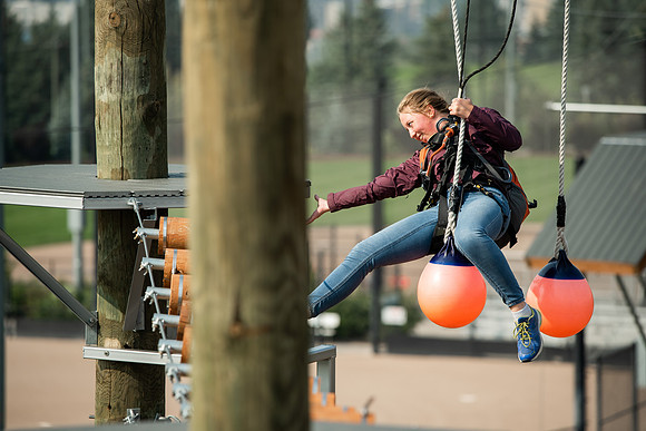 BYUI Students climbing around the ropes course by the upper fields in the summer of 2021.