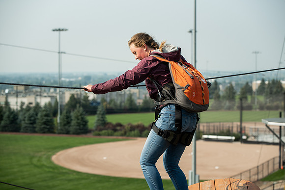 BYUI Students climbing around the ropes course by the upper fields in the summer of 2021.