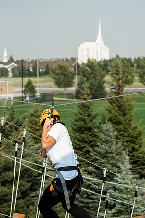 BYUI Students climbing around the ropes course by the upper fields in the summer of 2021.