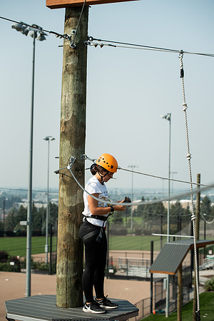 BYUI Students climbing around the ropes course by the upper fields in the summer of 2021.